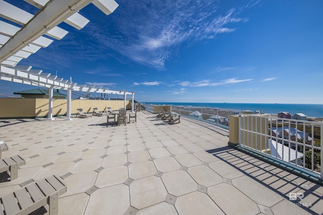 453 Dune Dr Unit 404, Gulf Shores, AL 36542 - view of patio / terrace with a pergola and a water view