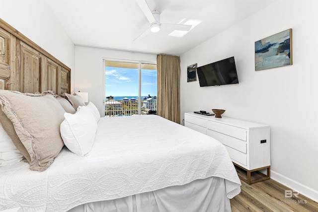 453 Dune Dr Unit 404, Gulf Shores, AL 36542 - bedroom with access to exterior, light wood-style floors, and ceiling fan