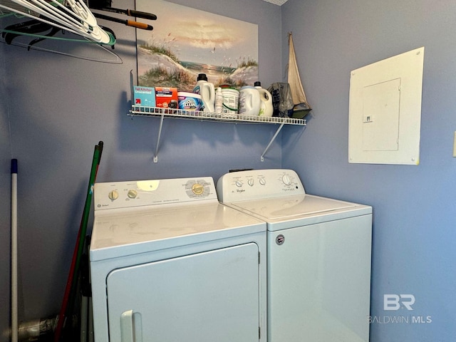 washroom with washer and dryer, laundry area, and electric panel