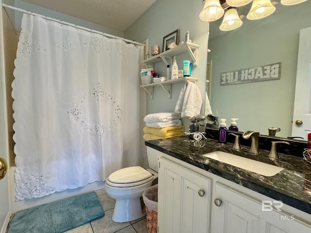 full bathroom with vanity, tile patterned floors, toilet, and a textured ceiling