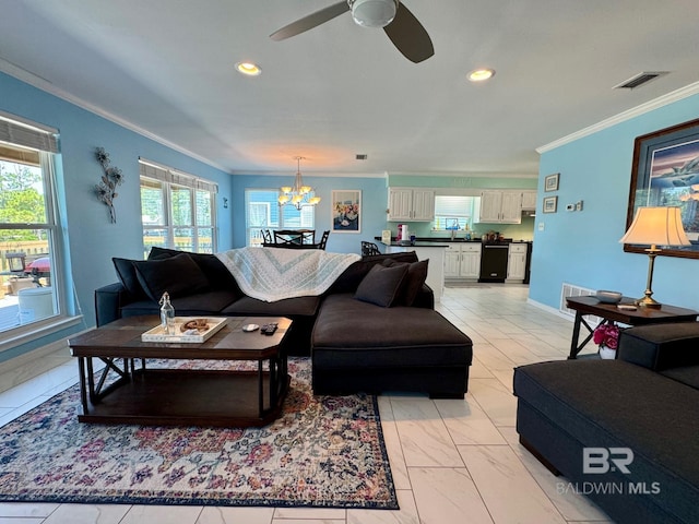 living area featuring recessed lighting, visible vents, and ornamental molding