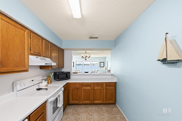 1872 W Beach Blvd Unit 206, Gulf Shores, AL 36542 - kitchen with under cabinet range hood, white electric stove, black microwave, brown cabinetry, and a textured ceiling