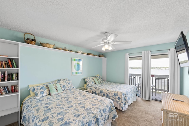 1872 W Beach Blvd Unit 206, Gulf Shores, AL 36542 - carpeted bedroom featuring access to exterior, a textured ceiling, and ceiling fan