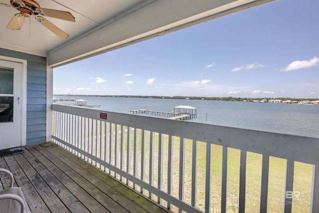 1872 W Beach Blvd Unit 206, Gulf Shores, AL 36542 - wooden terrace with a water view, ceiling fan, and a lawn
