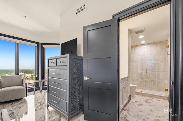 interior space featuring marble finish floor, visible vents, and recessed lighting