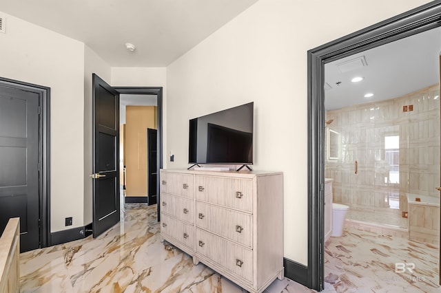 bedroom with ensuite bathroom, recessed lighting, visible vents, baseboards, and marble finish floor