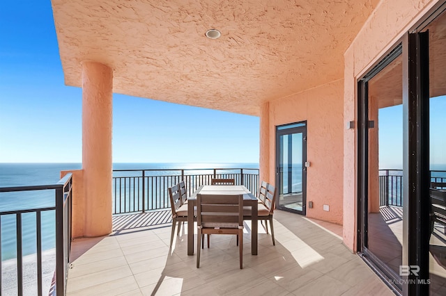 balcony featuring a water view