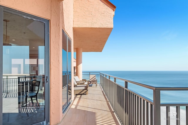 balcony featuring a water view