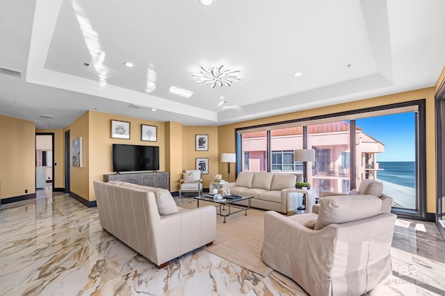 living room with marble finish floor, recessed lighting, a raised ceiling, visible vents, and baseboards