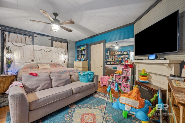 bedroom featuring hardwood / wood-style flooring and ceiling fan