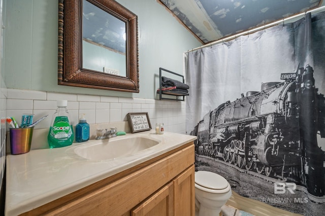 bathroom with vanity, toilet, and a shower with shower curtain