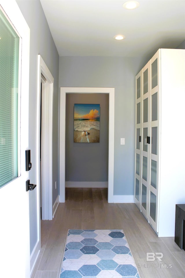 interior space with french doors and light hardwood / wood-style flooring