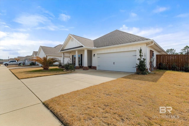 view of front of house featuring a garage and a front yard