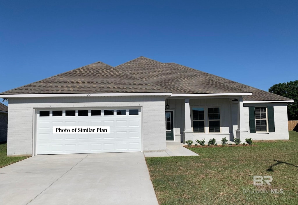 31081 Bauer Ave, Spanish Fort, AL 36527 - ranch-style house with a shingled roof, brick siding, concrete driveway, and a front yard