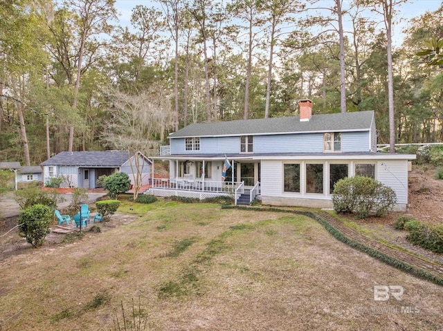 back of house featuring a porch