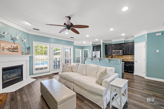 19083 County Road 13, Fairhope, AL 36532 - living area with ceiling fan, ornamental molding, recessed lighting, a glass covered fireplace, and dark wood finished floors