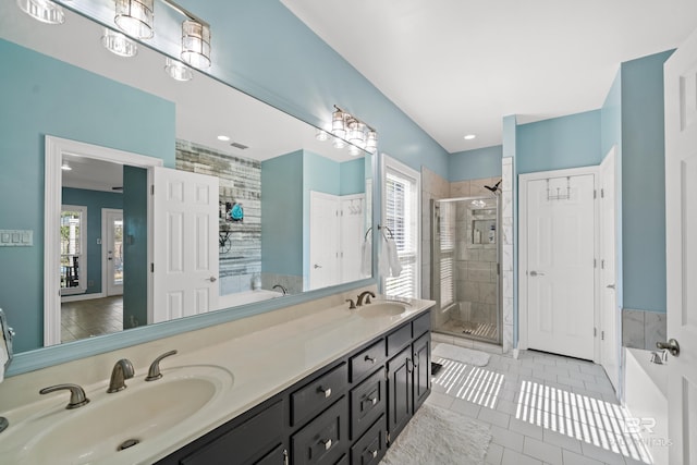 19083 County Road 13, Fairhope, AL 36532 - full bathroom featuring a shower stall, plenty of natural light, a bath, and tile patterned floors