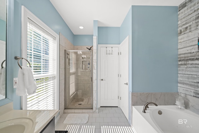 19083 County Road 13, Fairhope, AL 36532 - full bath with tile patterned flooring, a stall shower, a garden tub, and vanity