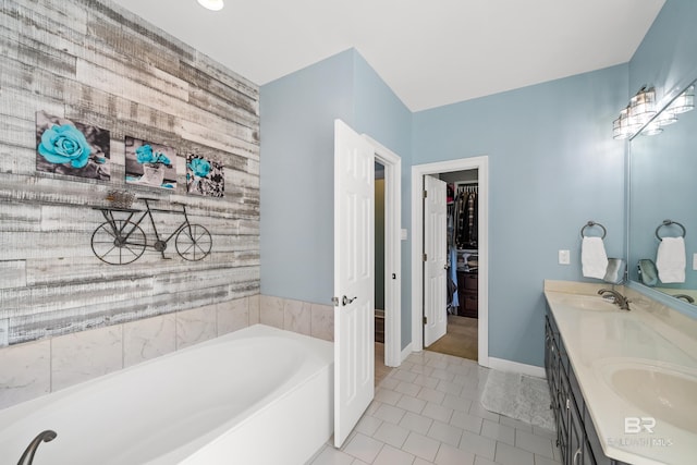 19083 County Road 13, Fairhope, AL 36532 - bathroom with a garden tub, double vanity, tile patterned flooring, and a spacious closet