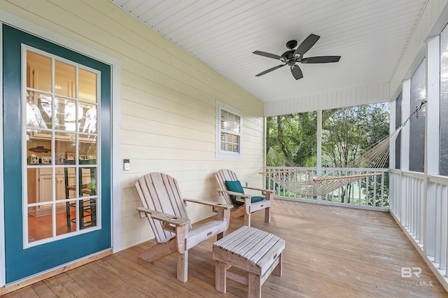 sunroom featuring ceiling fan