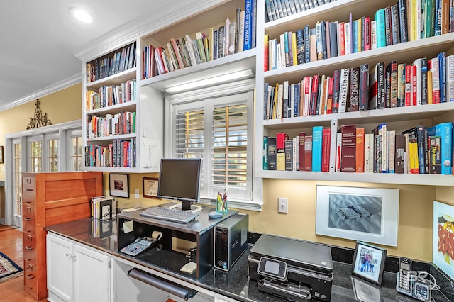 office with wood-type flooring and crown molding