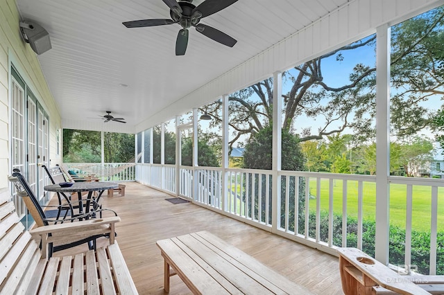 sunroom featuring a wealth of natural light and ceiling fan