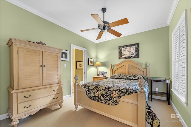 bedroom featuring ornamental molding, light carpet, and ceiling fan