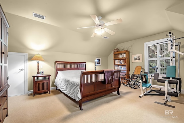 carpeted bedroom with vaulted ceiling and ceiling fan