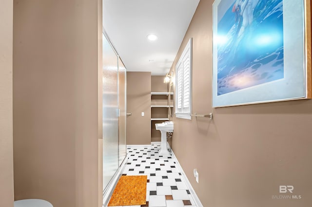 bathroom with walk in shower and toilet