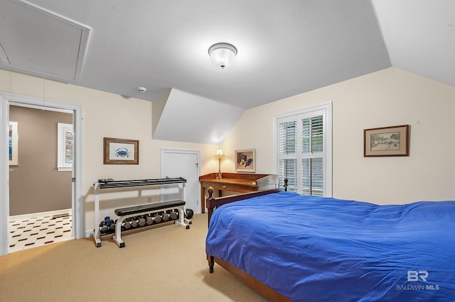 bedroom with vaulted ceiling and carpet