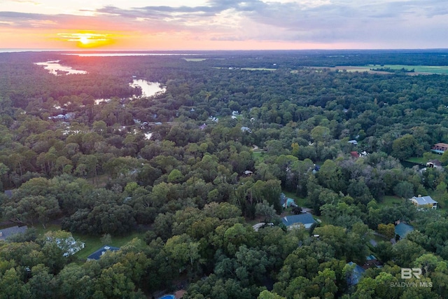 aerial view at dusk with a water view