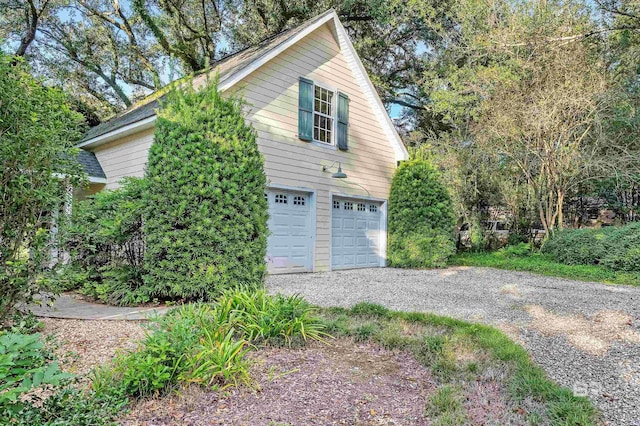 view of property exterior featuring a garage