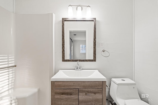 bathroom with vanity and toilet