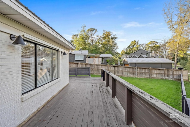 wooden deck with a lawn