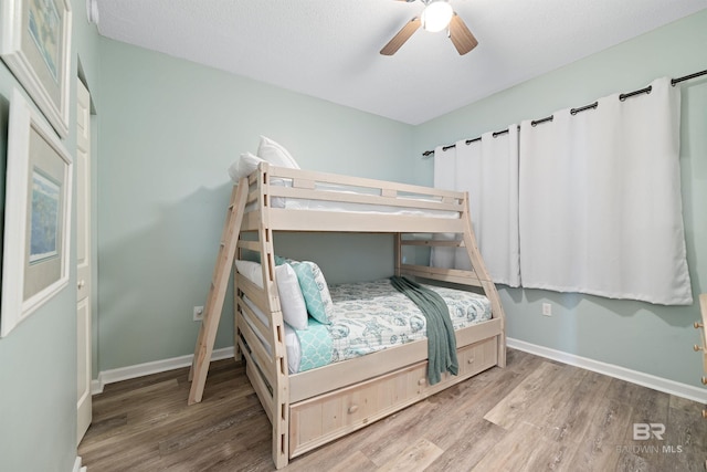 bedroom featuring ceiling fan and light hardwood / wood-style floors