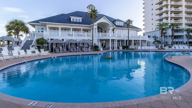 view of pool featuring a patio area