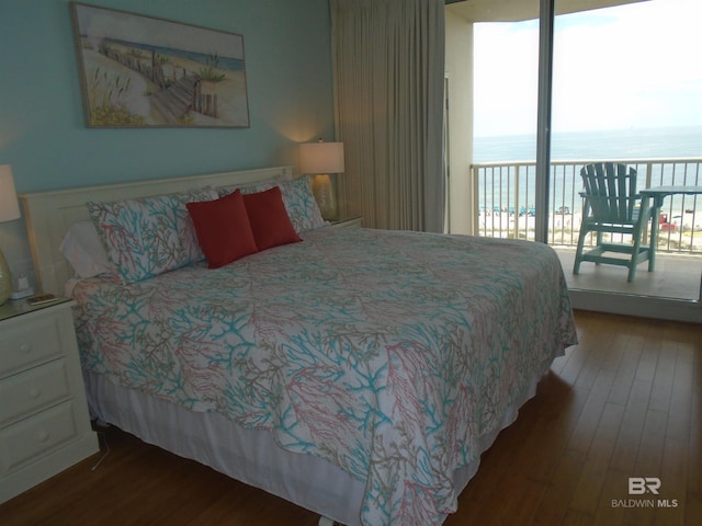 527 Beach Club Trl Unit D710, Gulf Shores, AL 36542 - bedroom with access to outside, multiple windows, wood finished floors, and a water view