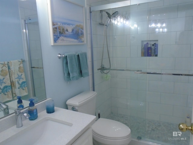 527 Beach Club Trl Unit D710, Gulf Shores, AL 36542 - bathroom with toilet, tiled shower, and vanity