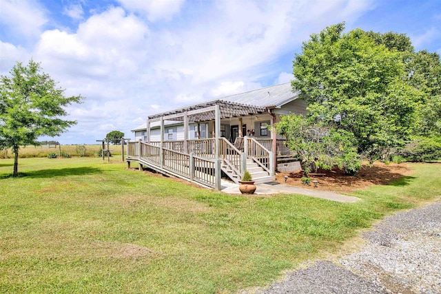 view of grassy yard featuring a deck