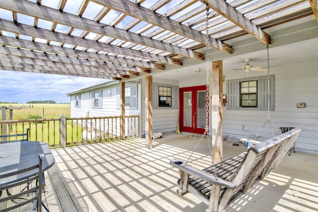 wooden deck featuring french doors, a pergola, and a ceiling fan