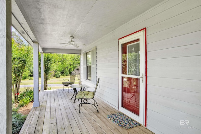 wooden terrace featuring a ceiling fan and covered porch