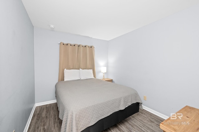 bedroom featuring dark hardwood / wood-style floors