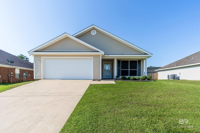 view of front facade with a garage, a front lawn, and central AC