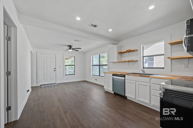 kitchen with white cabinets, dishwasher, dark hardwood / wood-style floors, and butcher block countertops