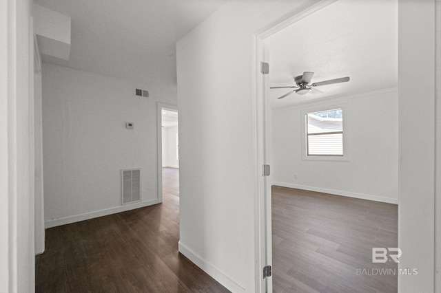 hall with dark wood-type flooring