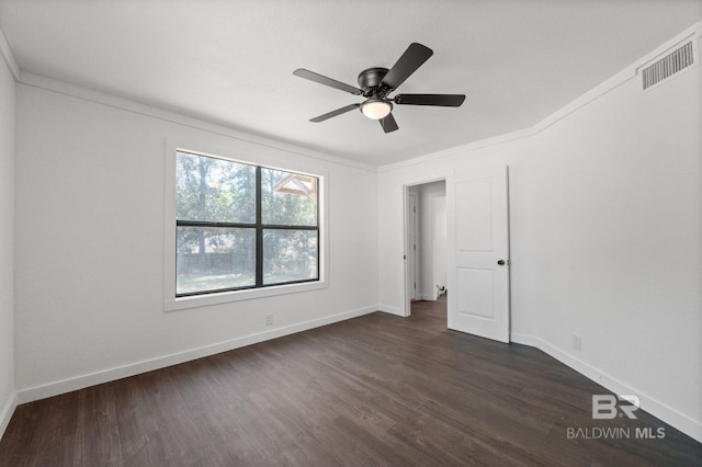 unfurnished bedroom featuring ornamental molding, ceiling fan, and dark hardwood / wood-style flooring