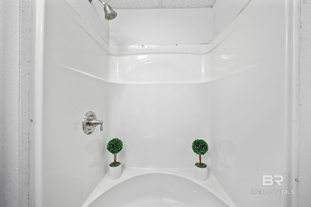 bathroom featuring a textured ceiling