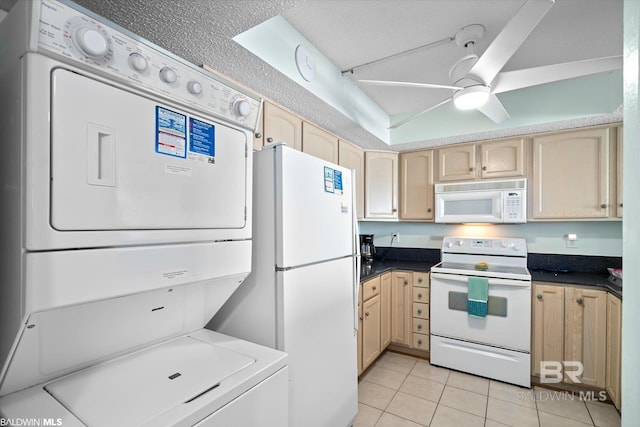 kitchen with stacked washer / dryer, light brown cabinetry, light tile patterned flooring, white appliances, and a ceiling fan