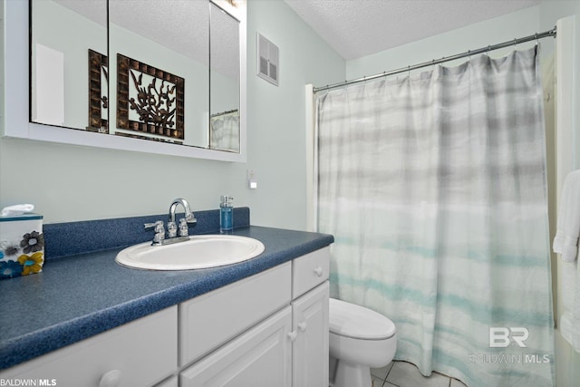 bathroom with visible vents, toilet, vanity, a shower with curtain, and a textured ceiling