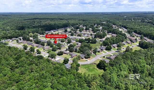 11116 Sturbridge Loop, Daphne, AL 36526 - aerial view of property and surrounding area with a heavily wooded area and nearby suburban area